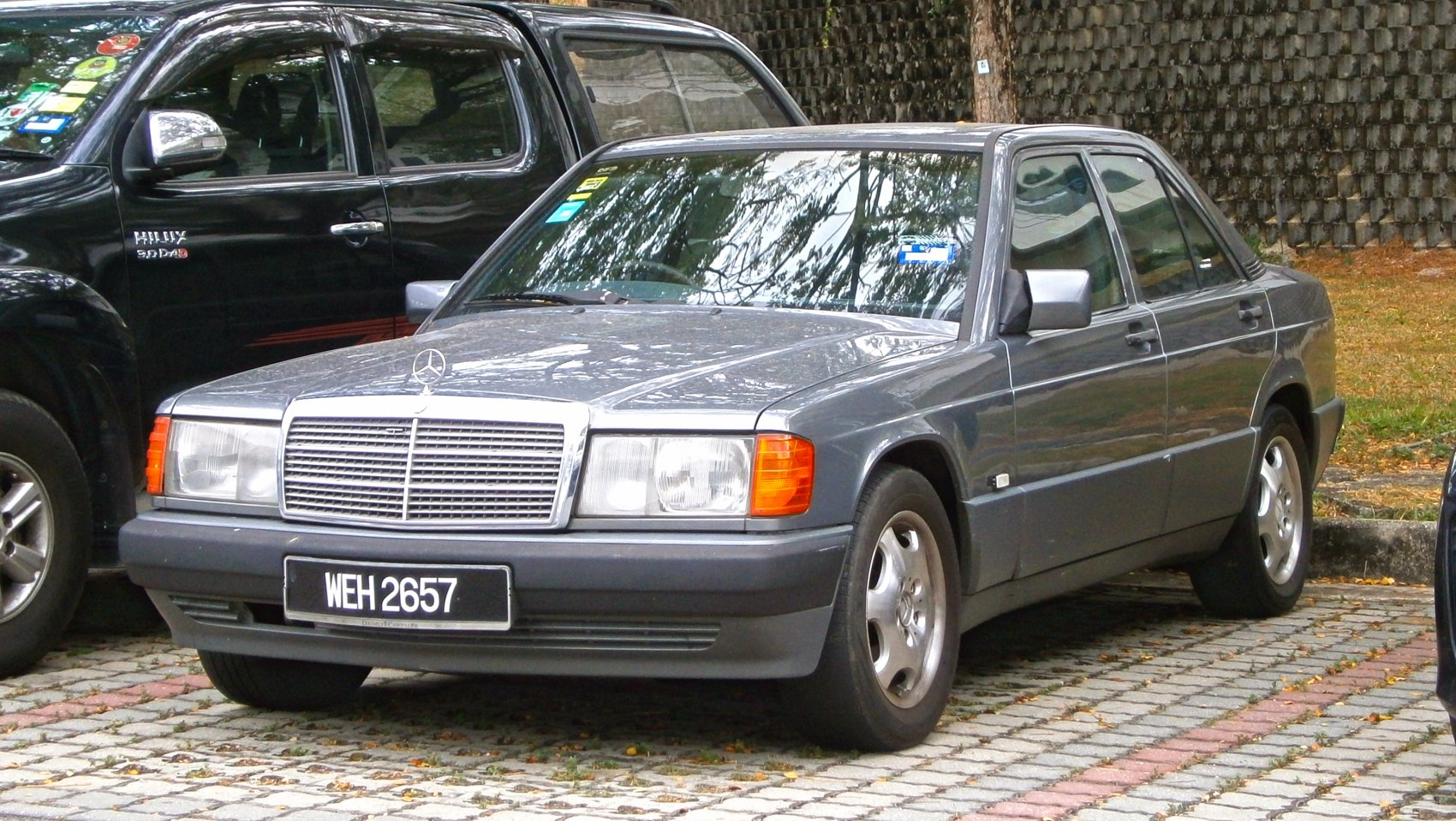 Classic compact sedan with distinctive front grille and four-door layout