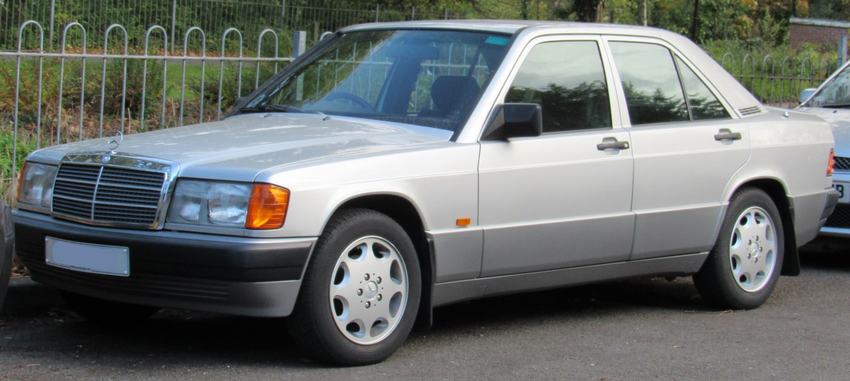 Silver 1988 sedan front and side view with distinct headlights and grille