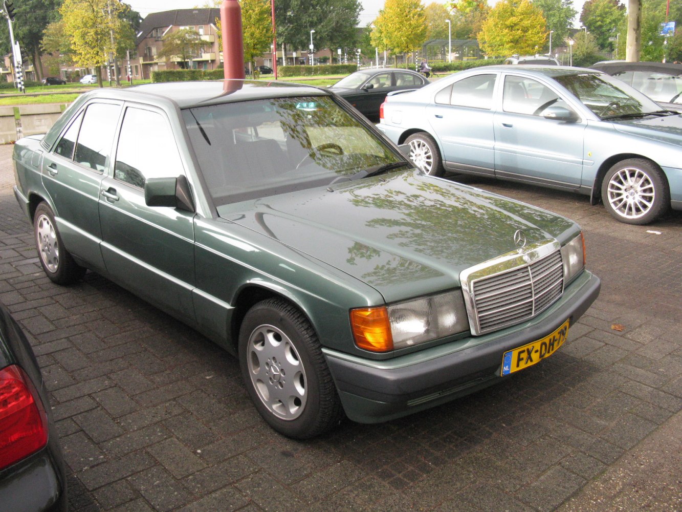 Front angle of a classic sedan highlighting grille and headlamp design