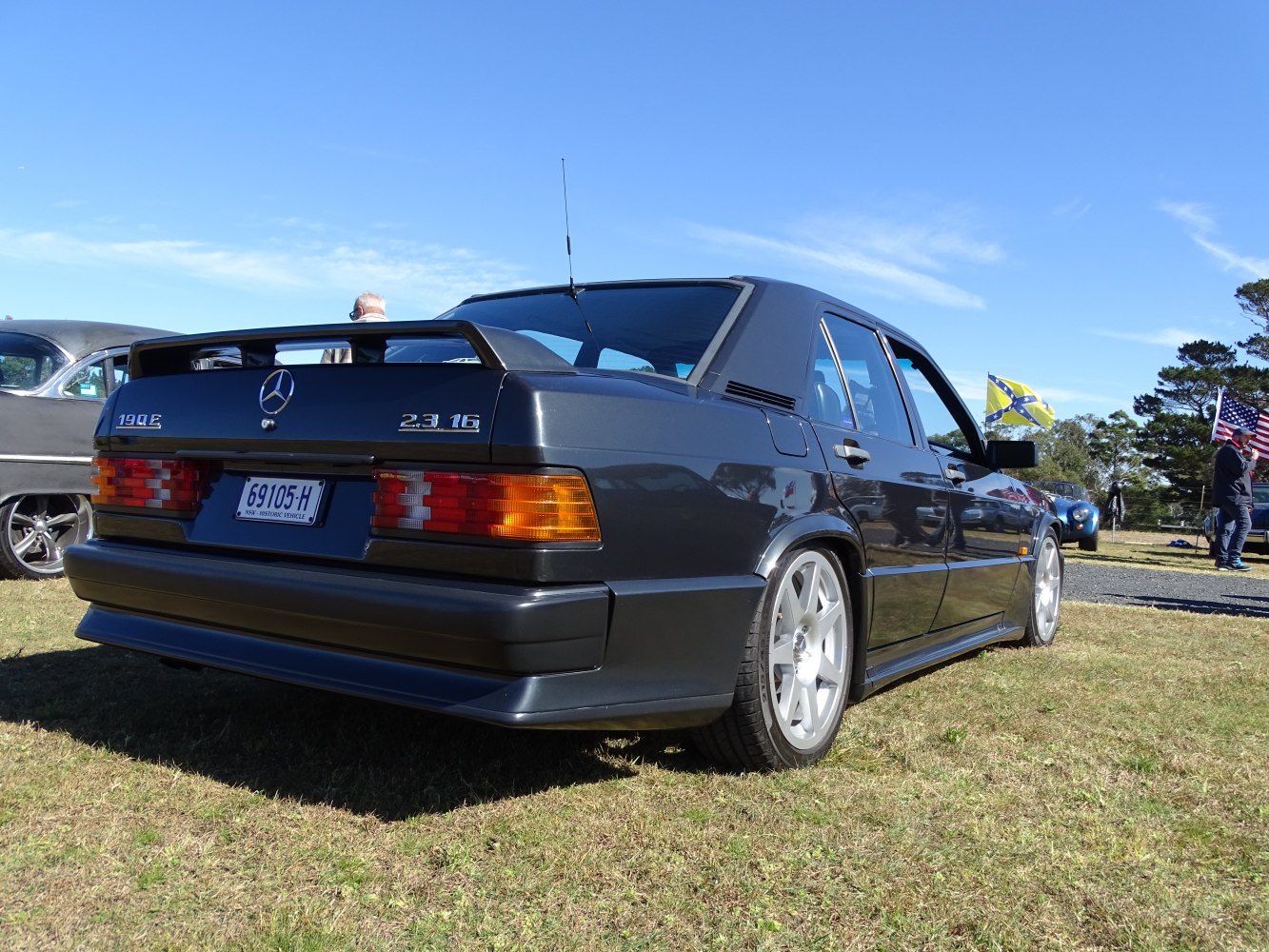 Rear view with spoiler and distinctive taillights in outdoor environment