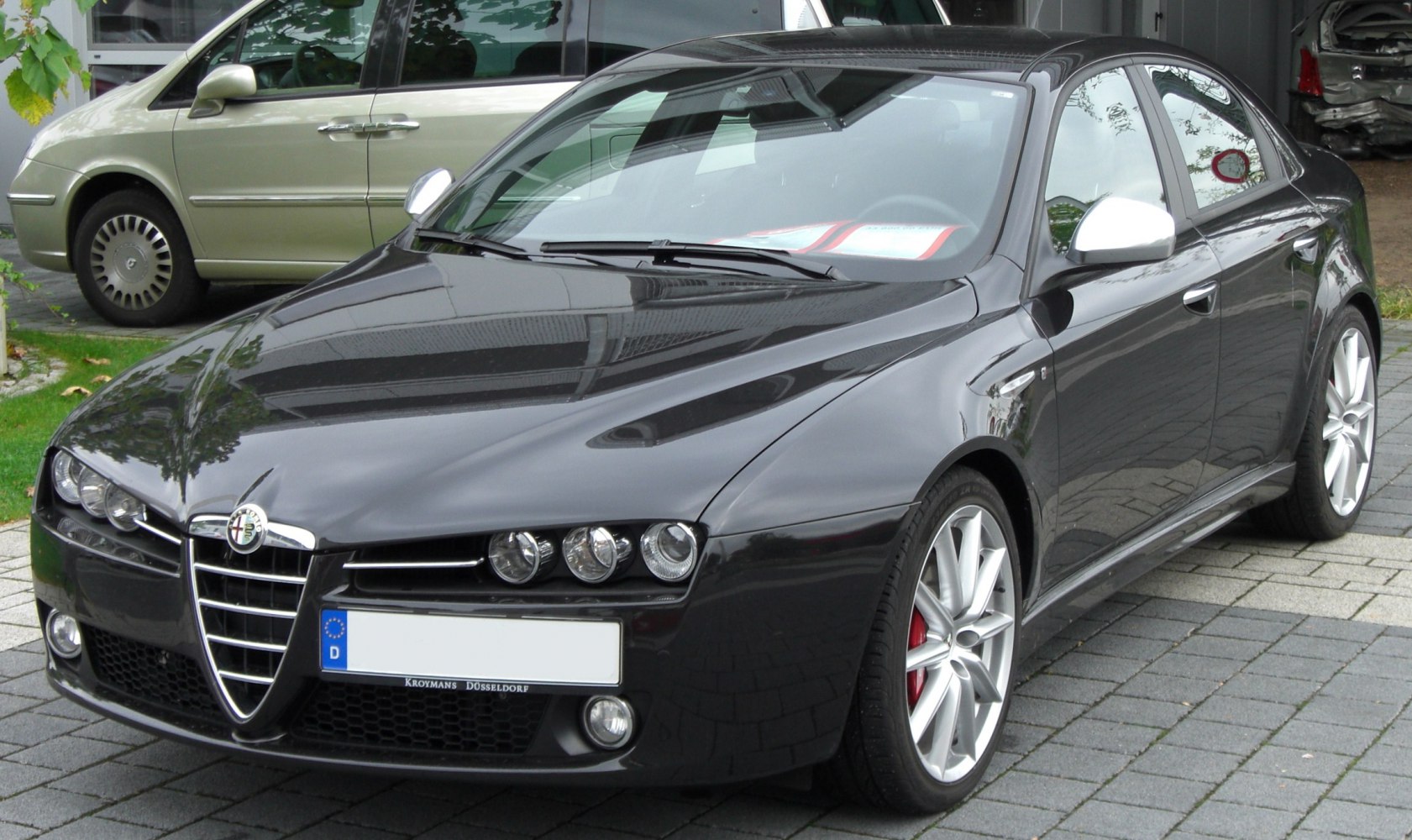 Front view with triple headlights and shield grille
