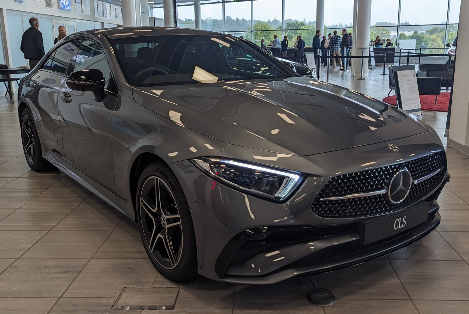 Sleek front fascia with distinctive LED headlights and sporty black alloy wheels