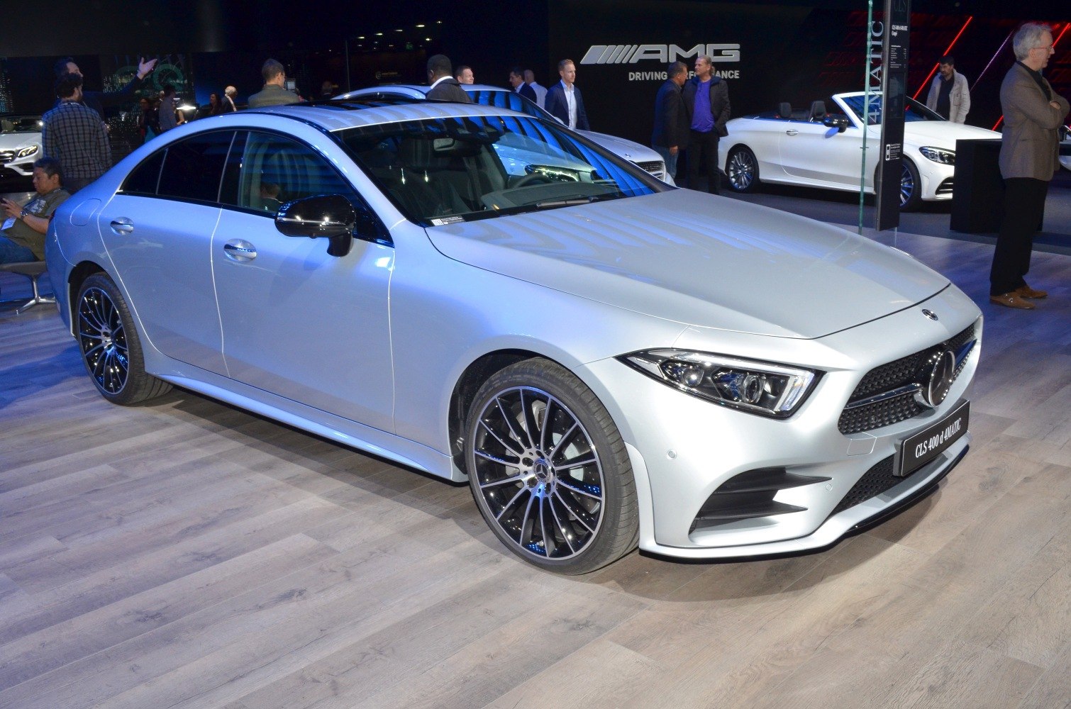 Front side view of luxury sedan with LED headlights and alloy wheels
