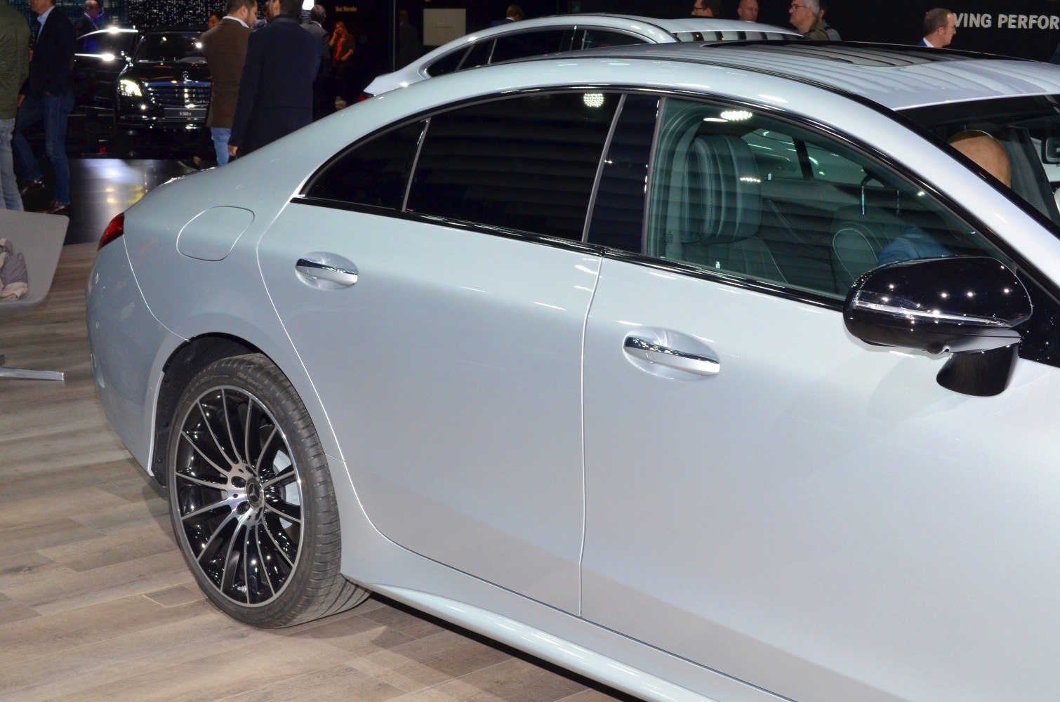 Side profile and alloy wheel design of a modern grey coupe