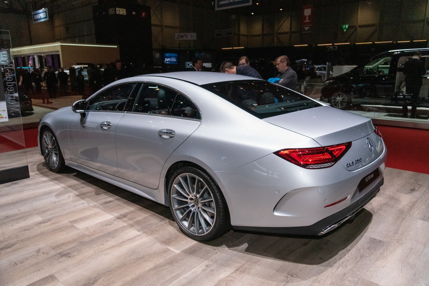 Rear view of a sleek silver luxury coupe with stylish alloy wheels.