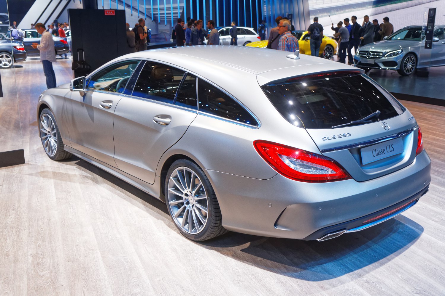 Rear side view of silver luxury wagon with sporty alloy wheels