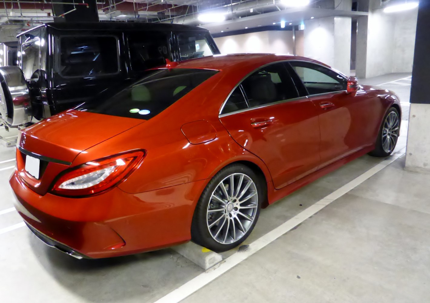 Rear side view of sleek luxury coupe with alloy wheels