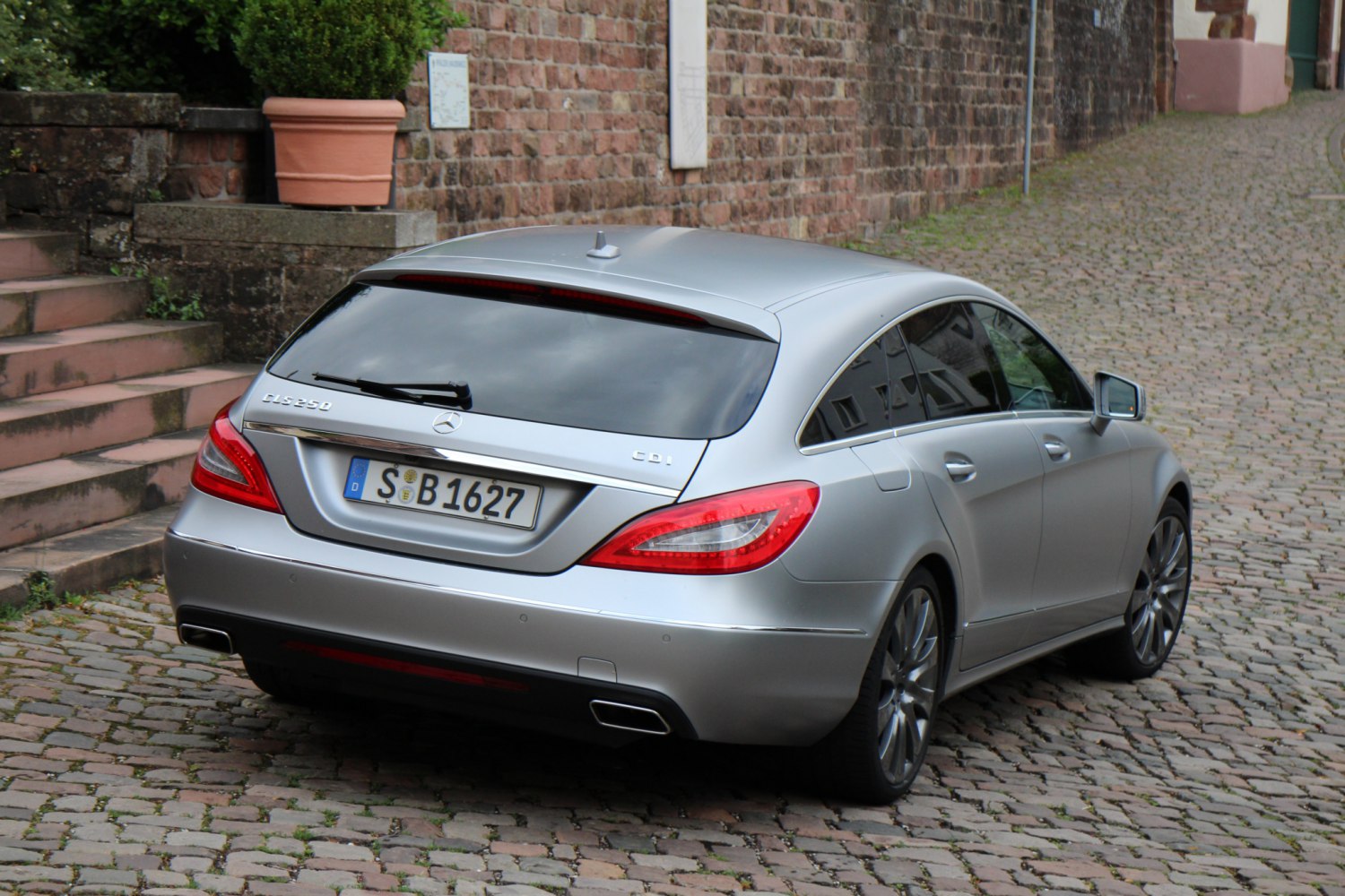Rear view of sleek luxury wagon with LED taillights and panoramic rear window