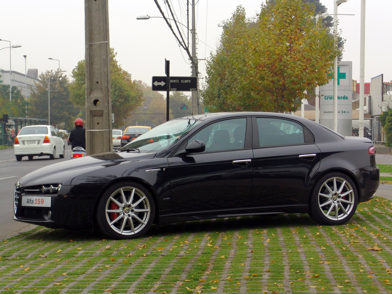 Side view of a sedan with alloy wheels in black color