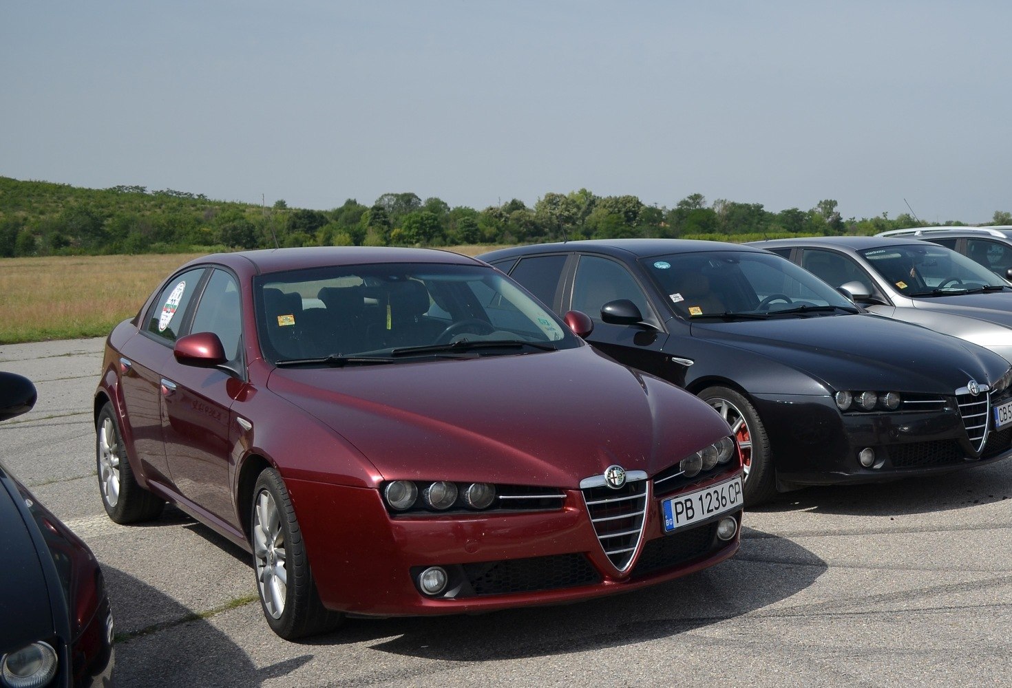 Car front view with triangular grille and quad headlights