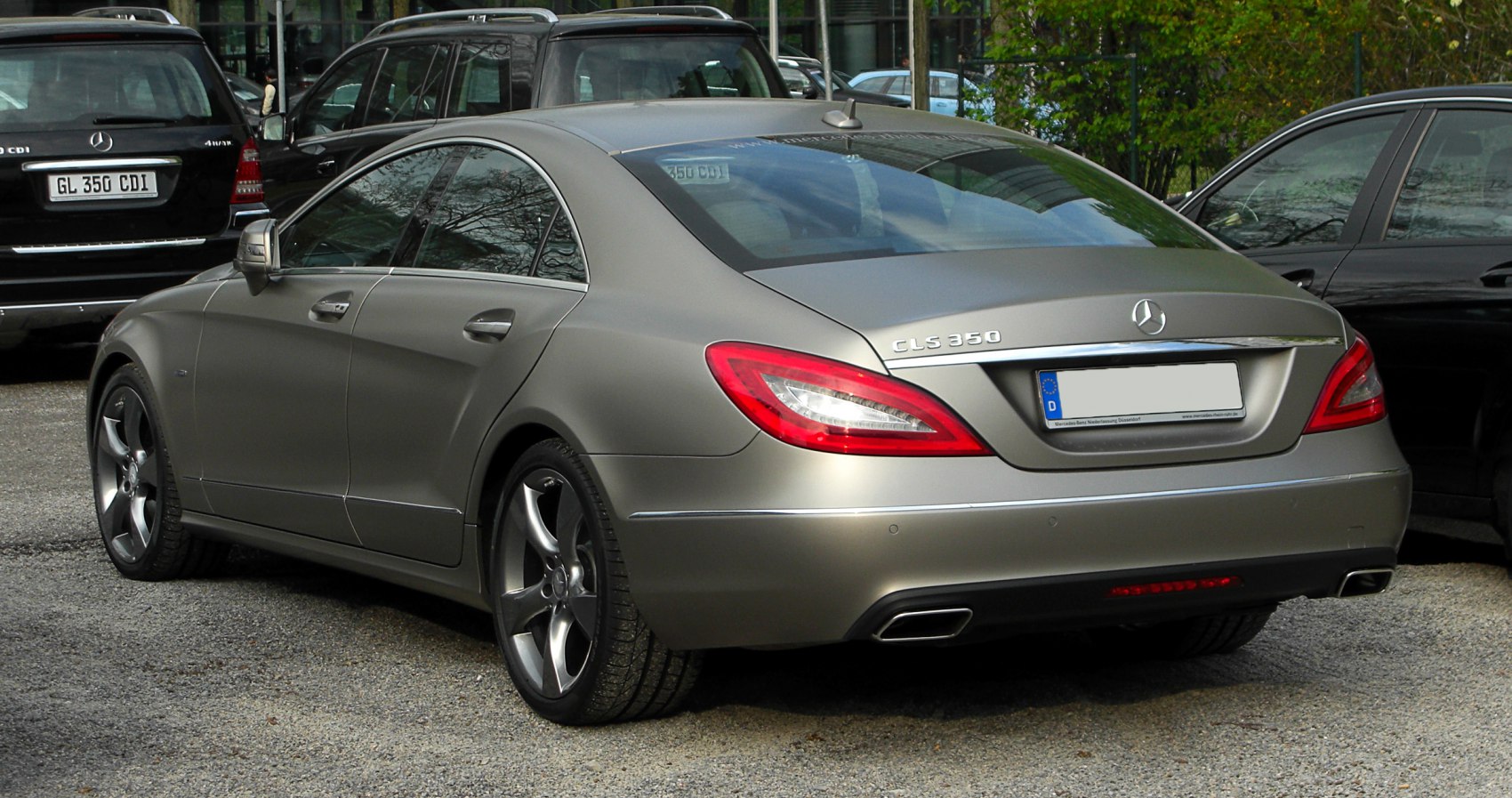 Rear view of a luxury coupe with distinctive taillights and dual exhausts