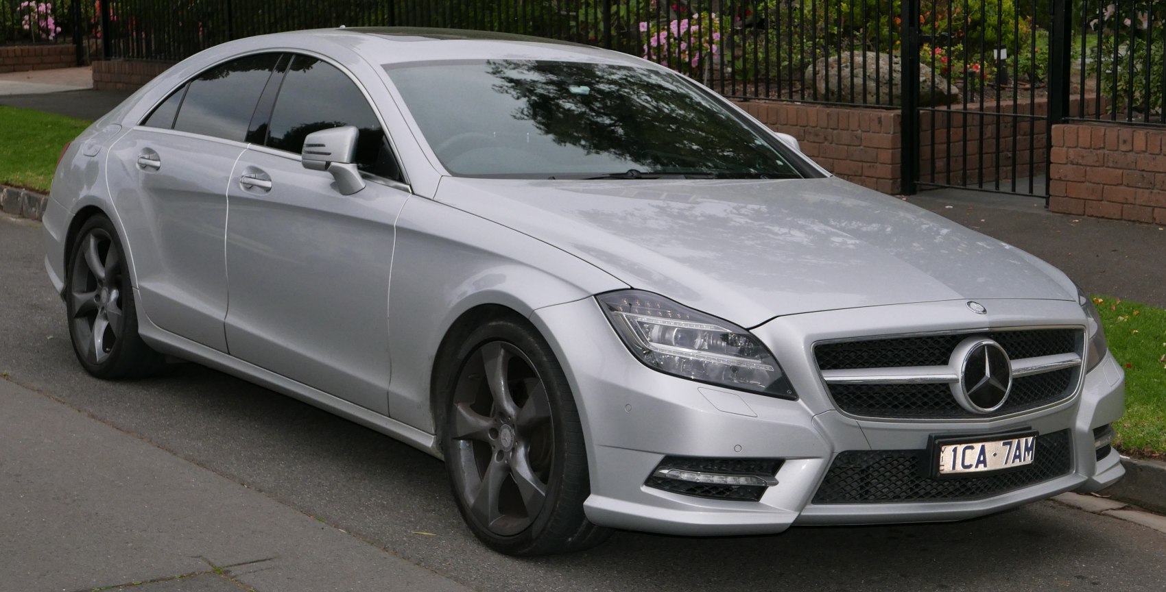 Front side view with LED headlights and sleek silver exterior