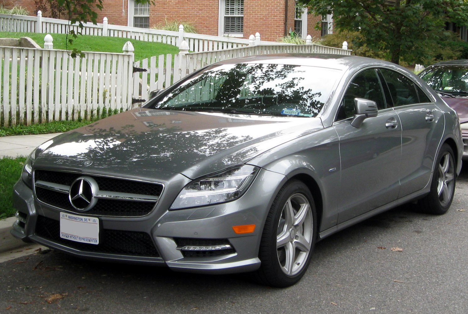 Front exterior view with LED headlights, alloy wheels, and distinctive grille