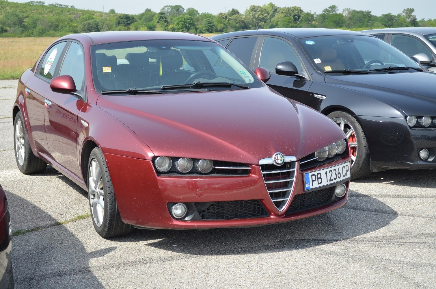 Distinctive front grille and triple headlights of a sedan