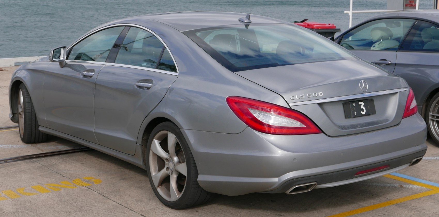 Sleek coupe design with rear and side view, distinctive taillights