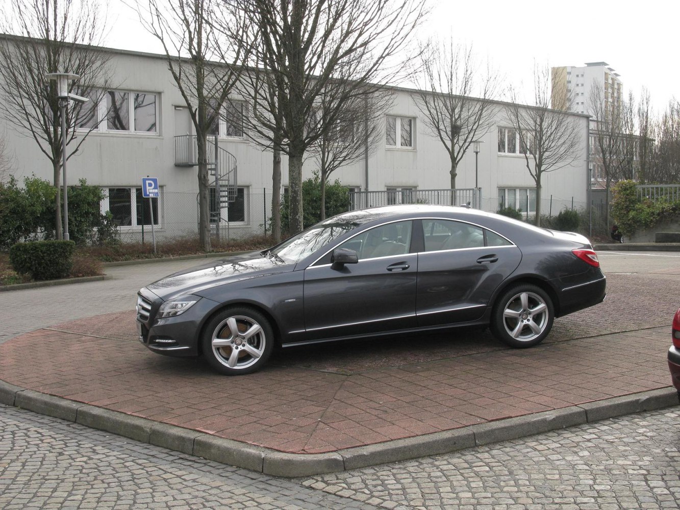 Elegant four-door coupe with sleek design and alloy wheels.