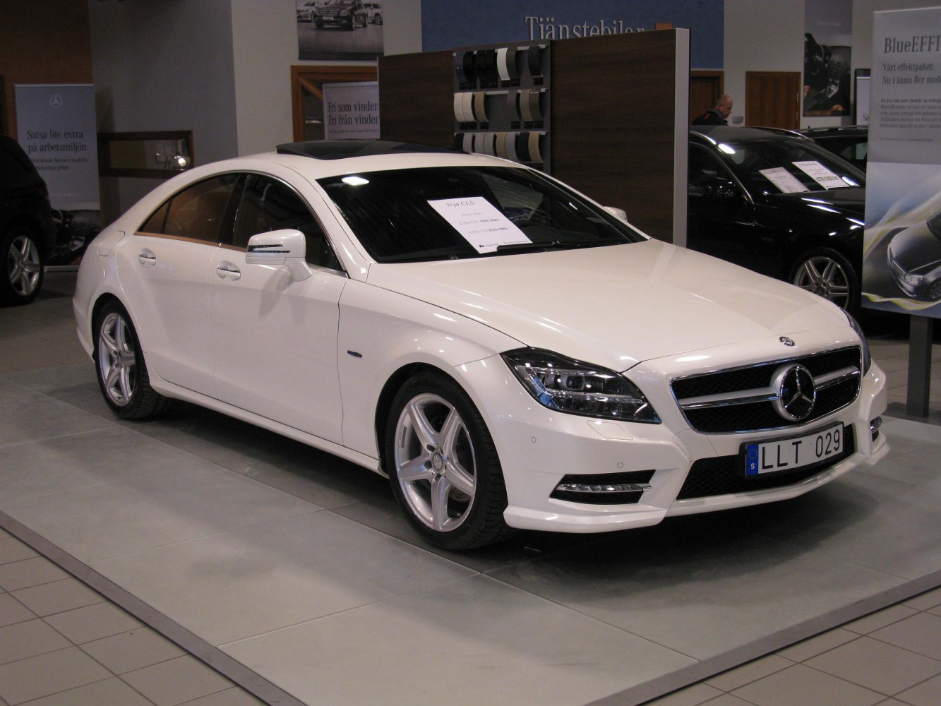 White luxury coupe with LED headlights and sunroof