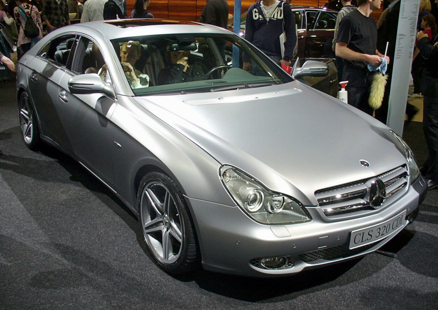 Sleek front end and alloy wheels of silver luxury coupe
