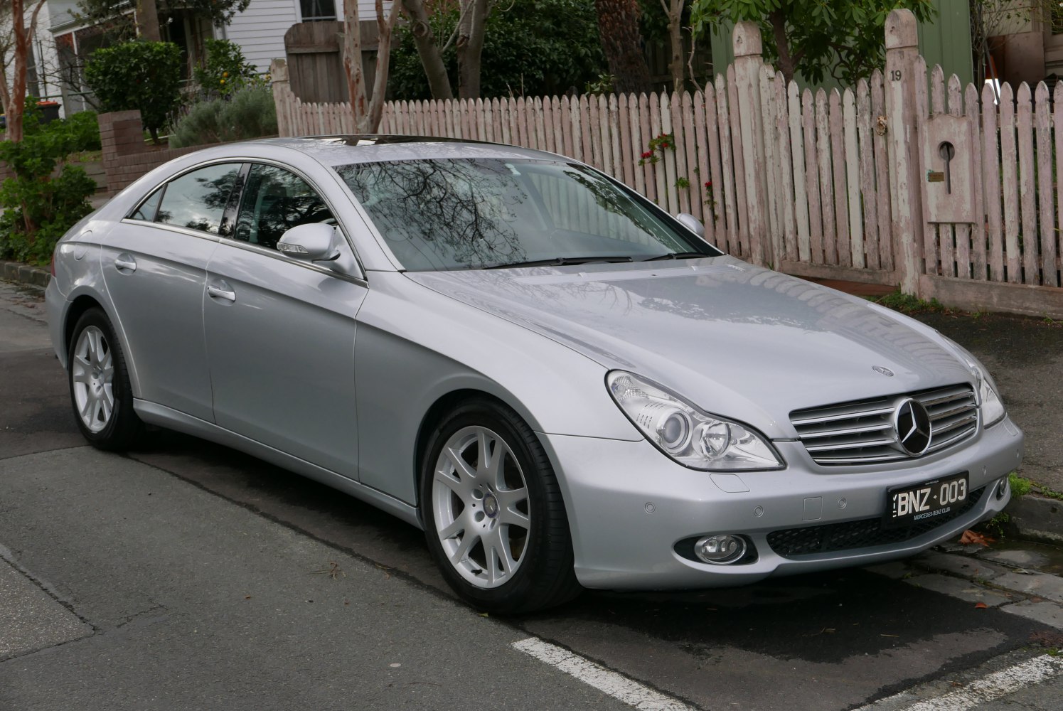 Front side view with headlights and grille of a coupe car
