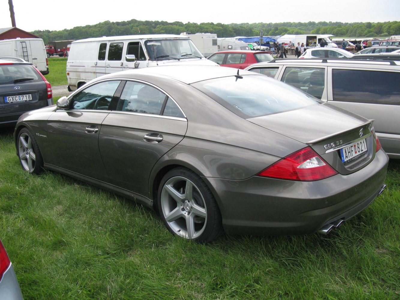 Rear side view of a sedan with sloping roofline and AMG badging