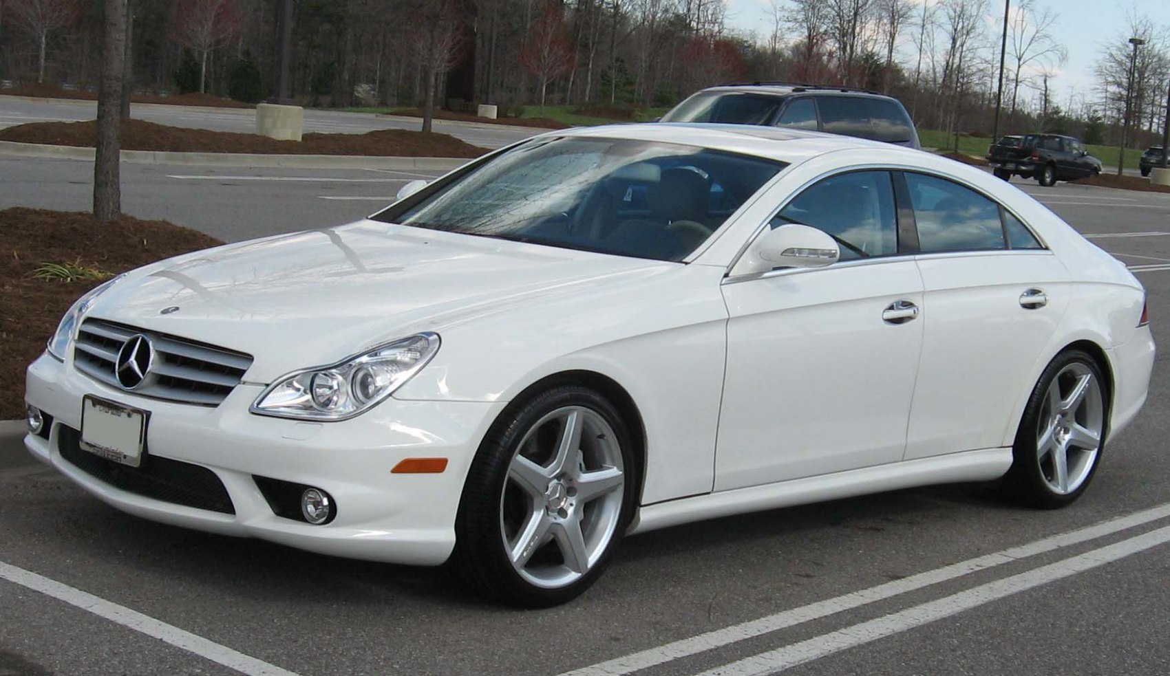 White luxury coupe with alloy wheels and sleek aerodynamic shape