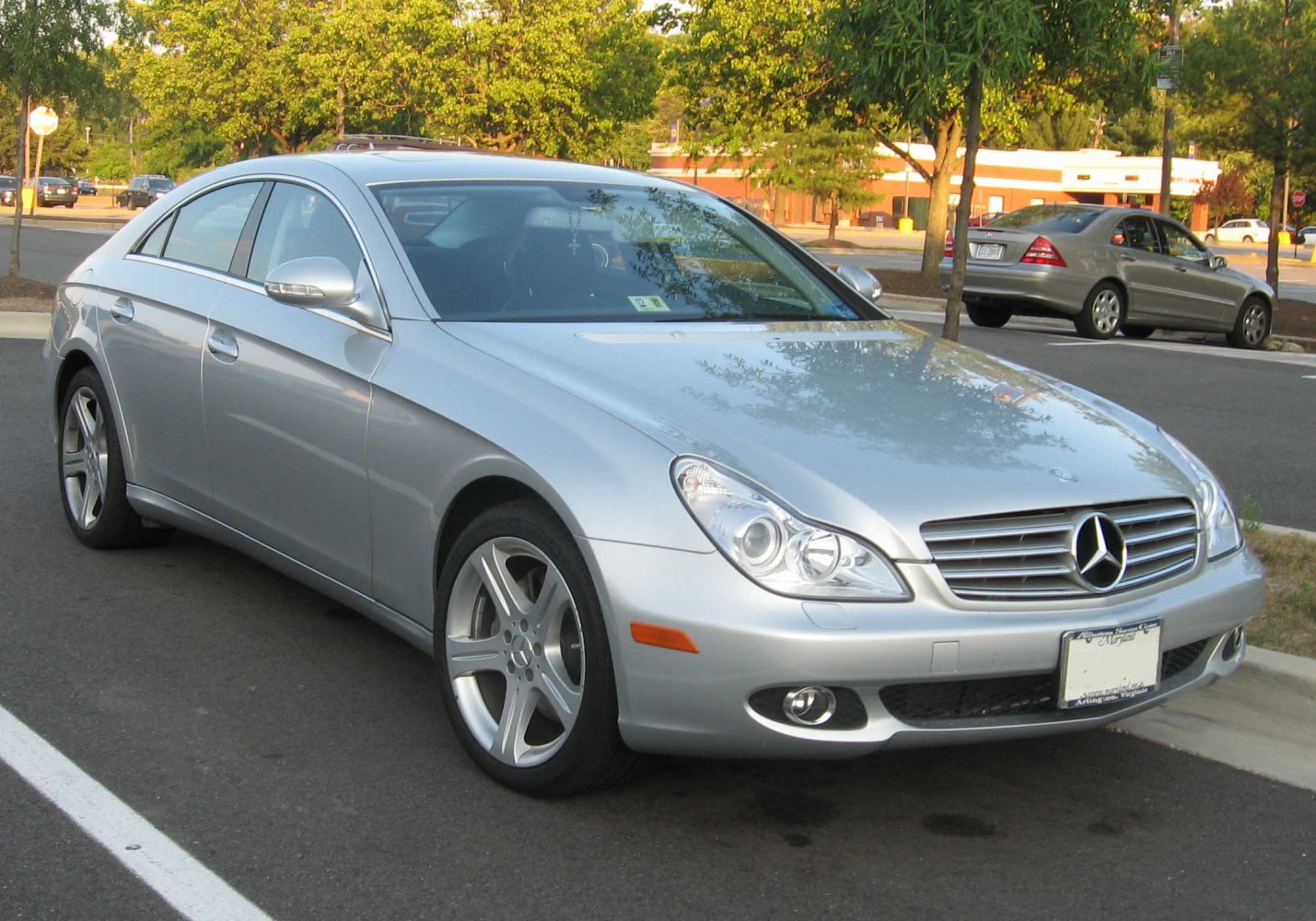 Silver coupe front-side view with distinctive headlights and alloy wheels