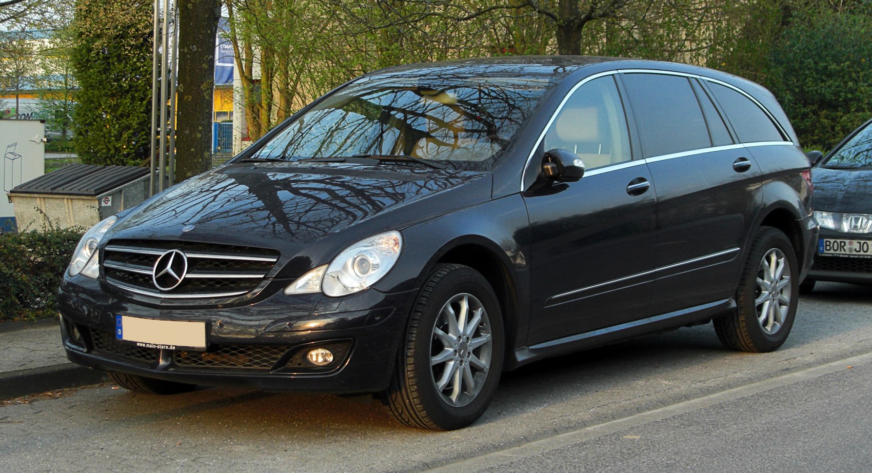 Front side view with distinctive grille and headlights