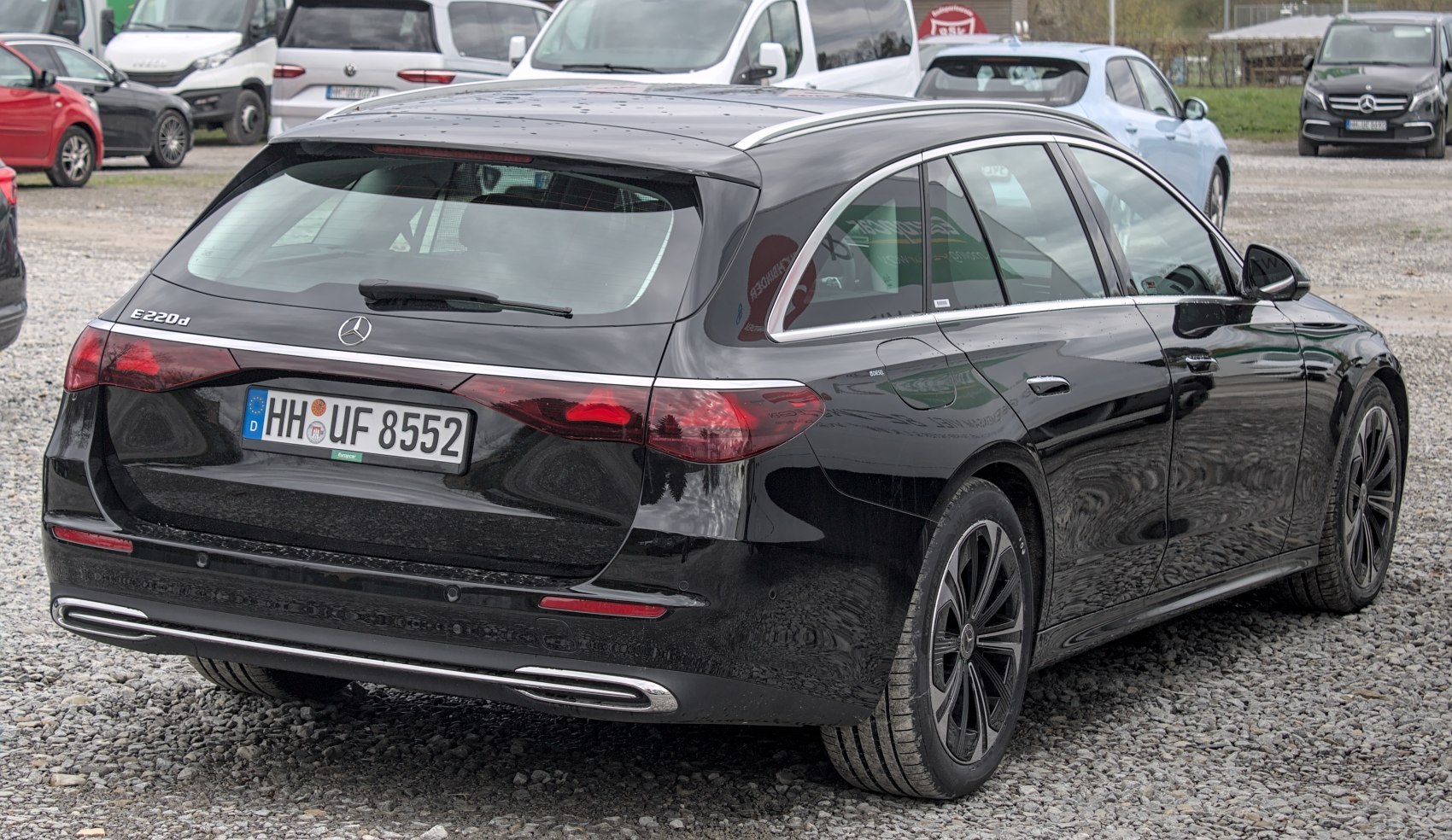 Rear and side view of a black luxury station wagon with modern taillights and aerodynamic styling.