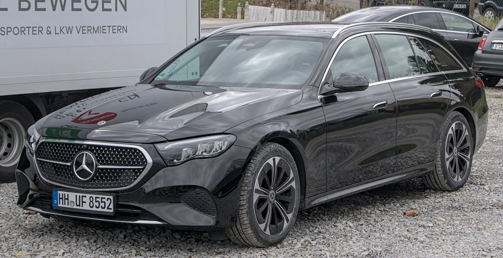 Front and side view of modern luxury station wagon with sleek design and alloy wheels