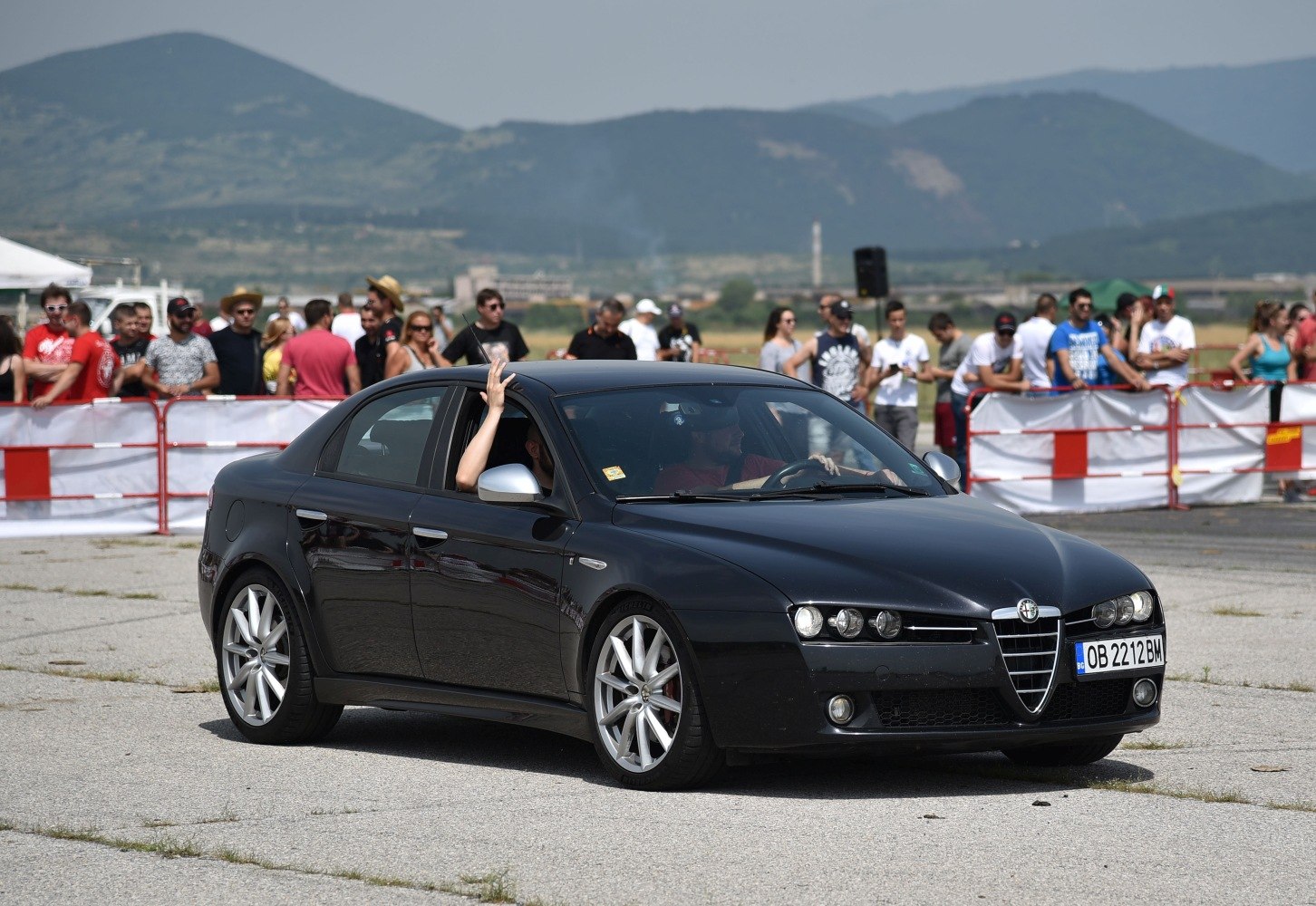 Sedan exterior front-side view with sporty wheels