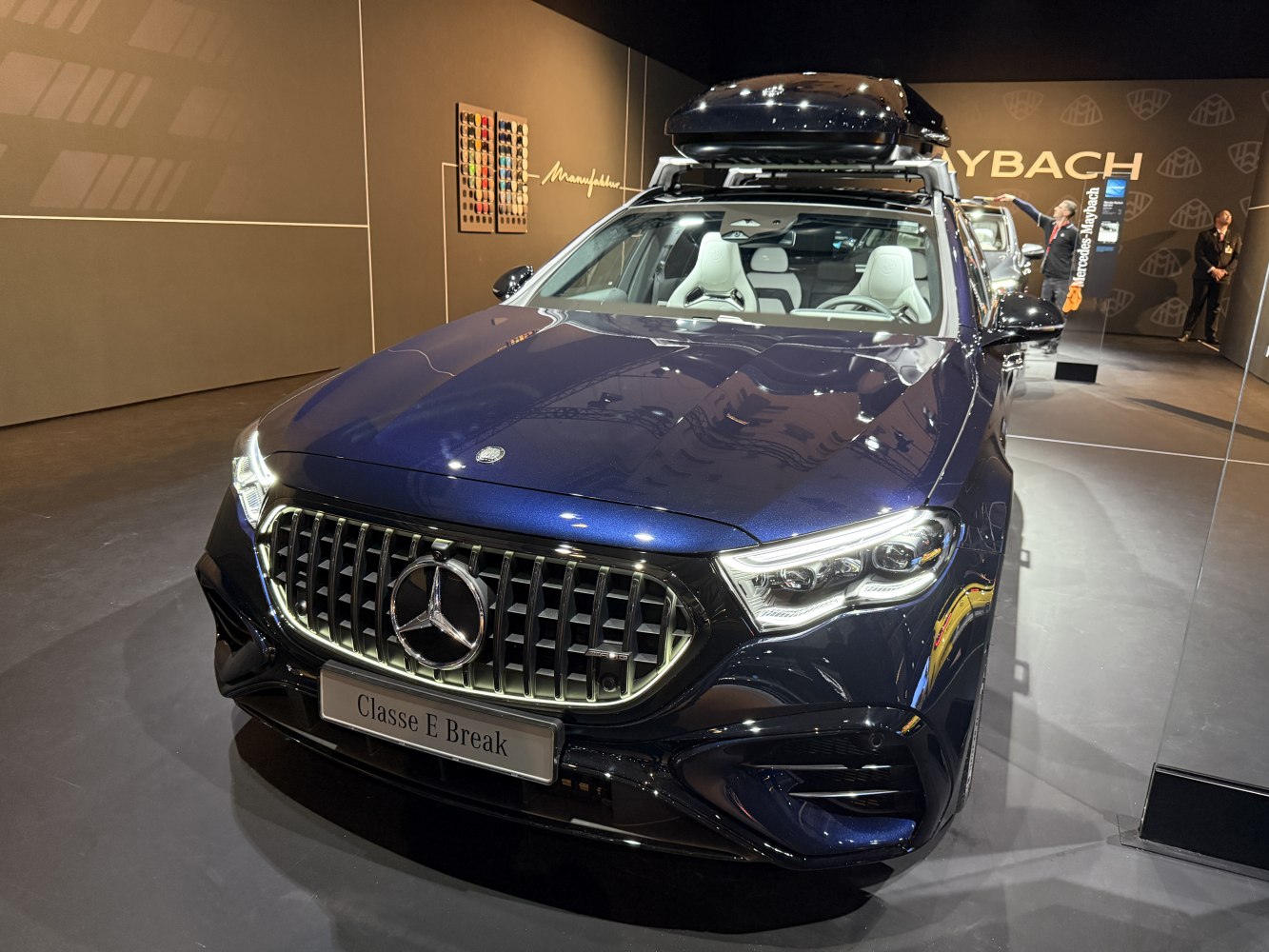 Luxury station wagon with striking front grille and sleek LED headlights.