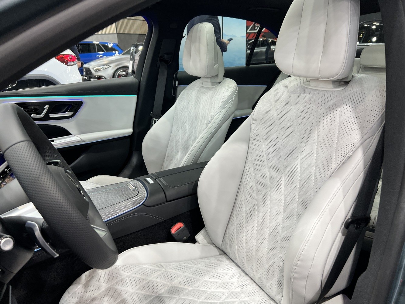 White quilted leather front seats with detailed stitching and perforation