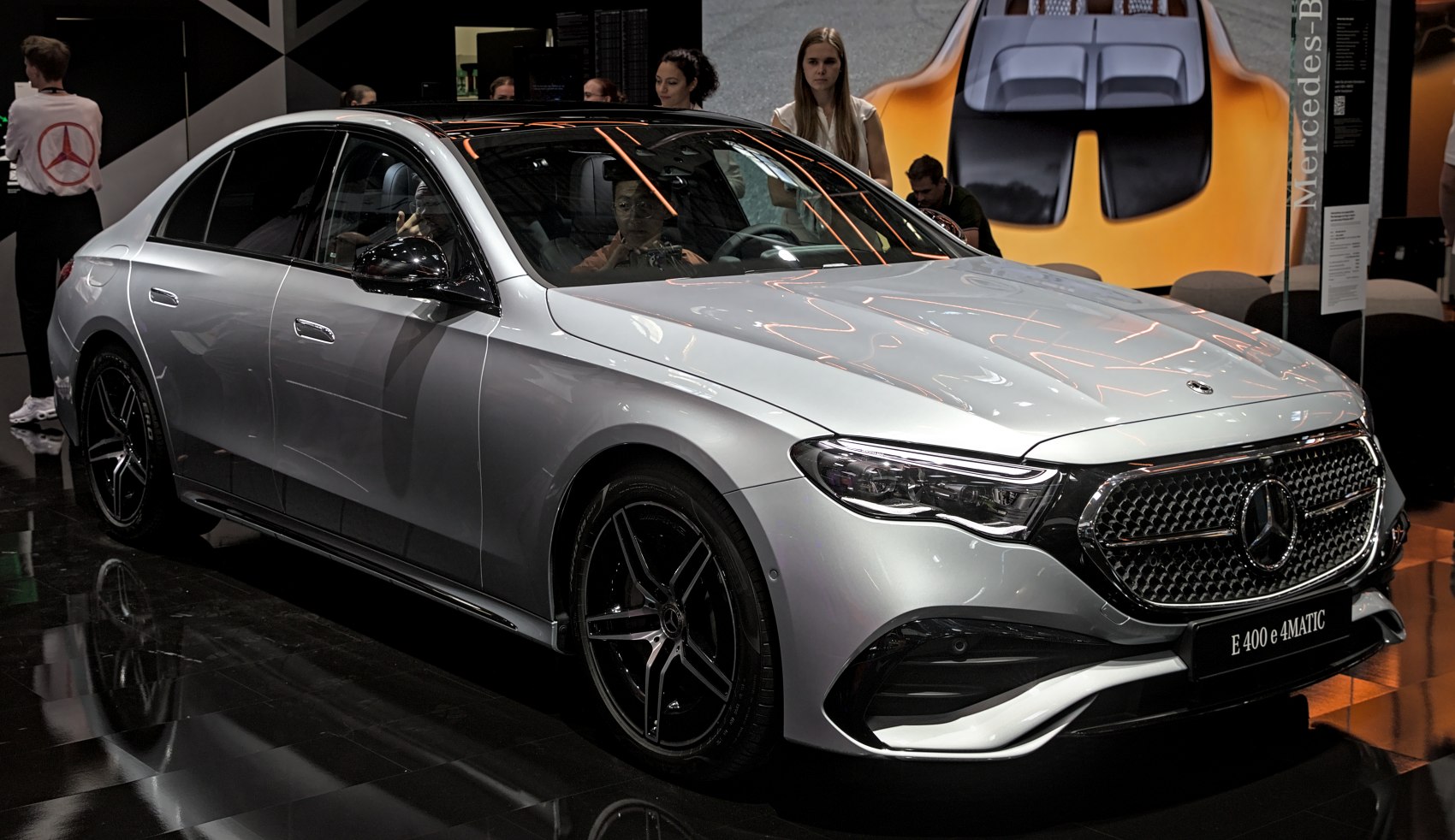 Sleek silver luxury sedan with prominent front grille and aerodynamic shape