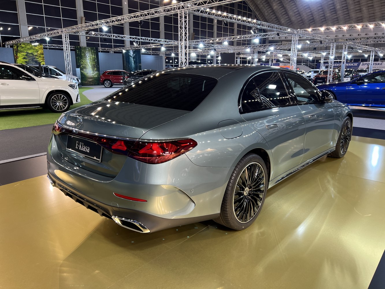 Sleek rear and side profile with tail lights and alloy wheels