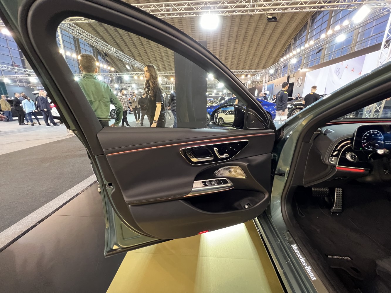 Interior door panel with ambient lighting and premium features