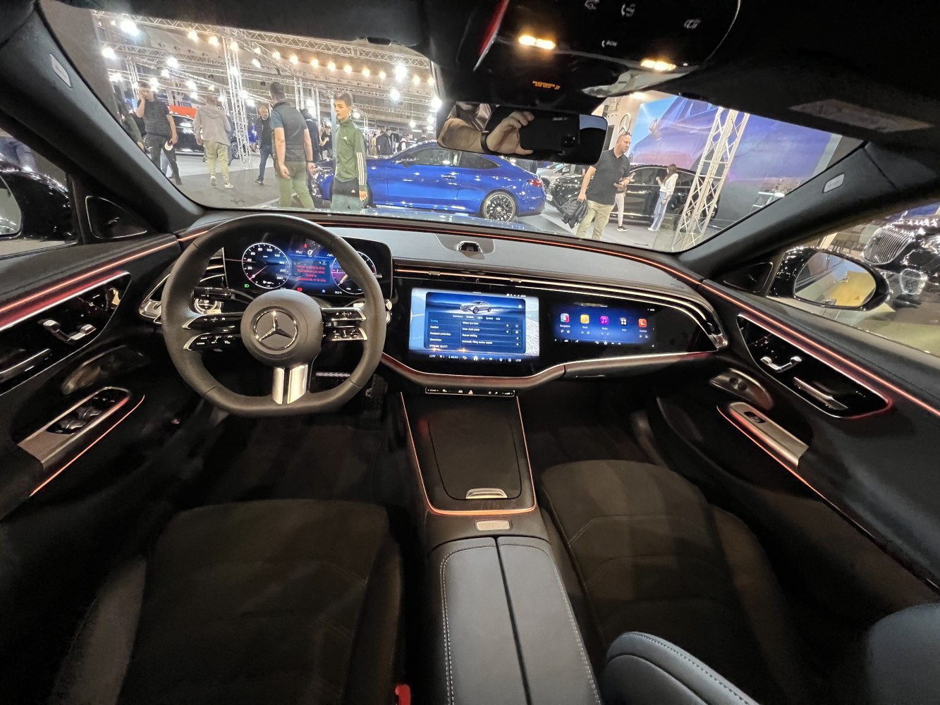 Dual digital dashboard and ambient lighting inside a luxury vehicle