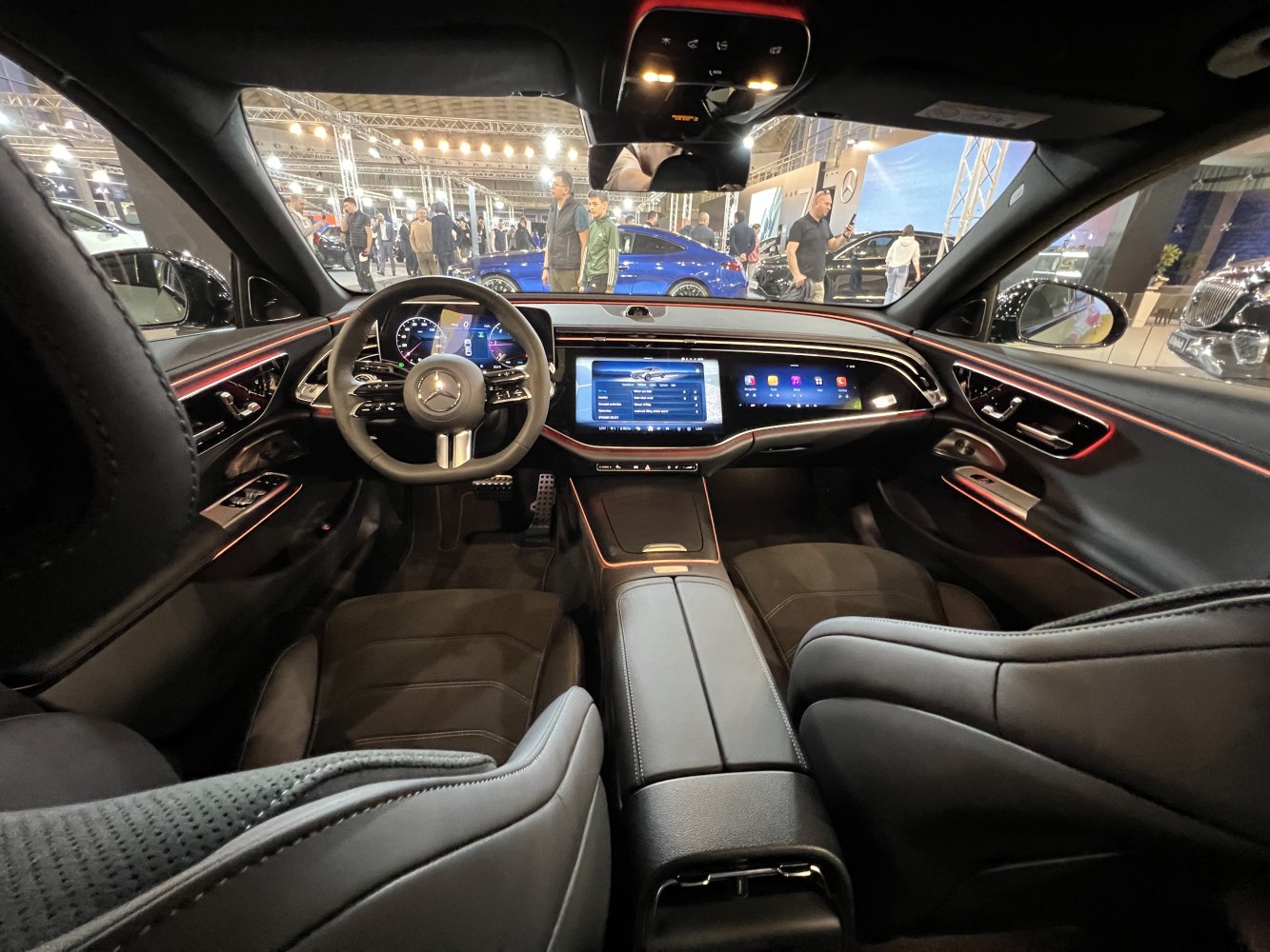 Digital dashboard and ambient lit luxury interior with steering wheel