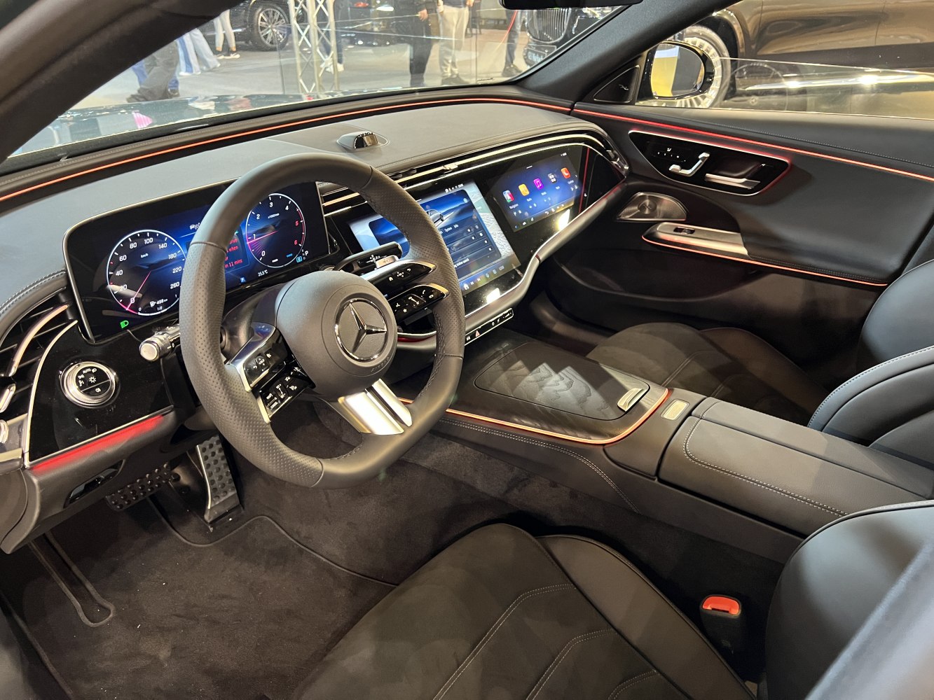 Modern car interior with digital instrument cluster and touchscreen displays