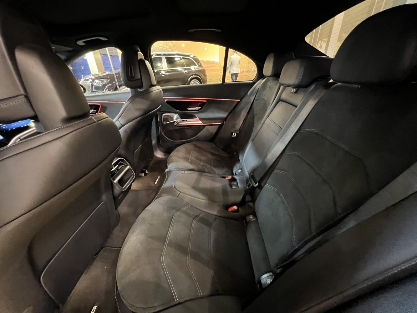 Premium black rear seats with leather upholstery and elegant door panel accents