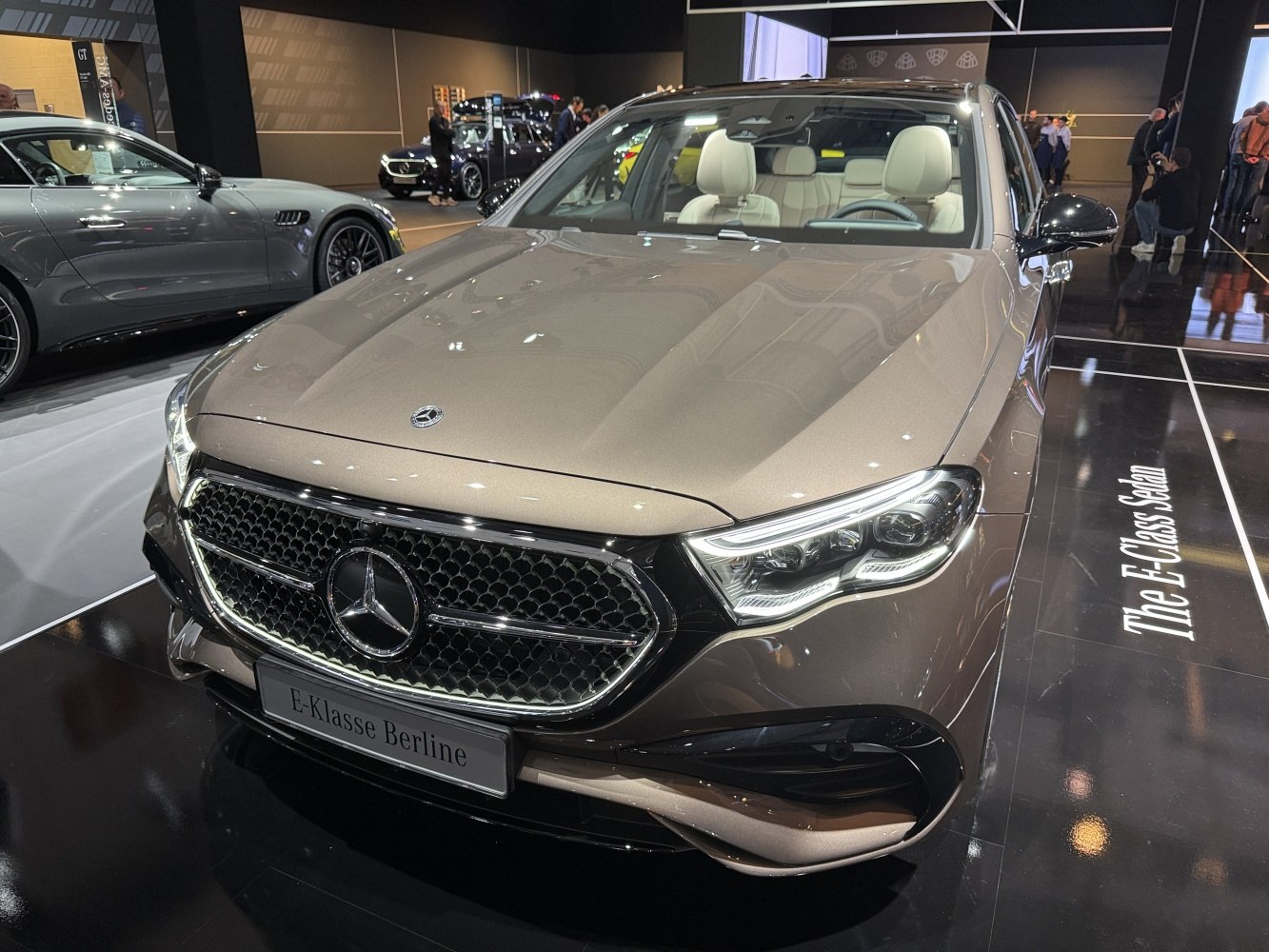 Luxury sedan front with diamond grille and advanced LED headlights