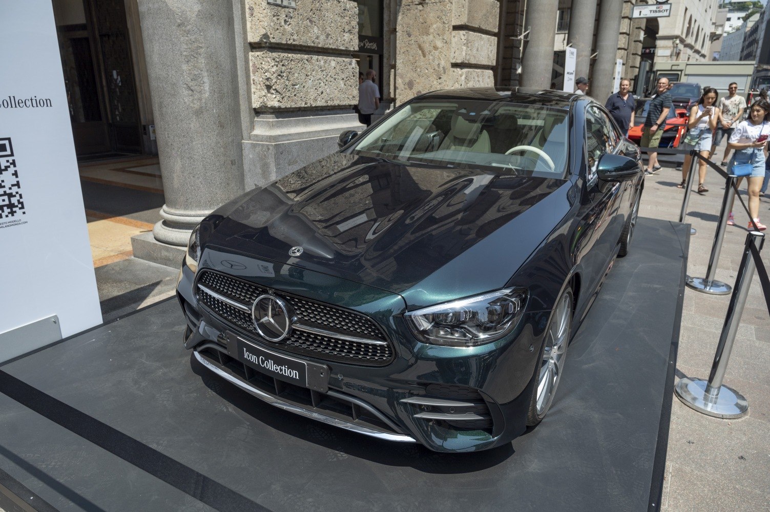 Front view of sleek luxury coupe with distinctive grille and headlights