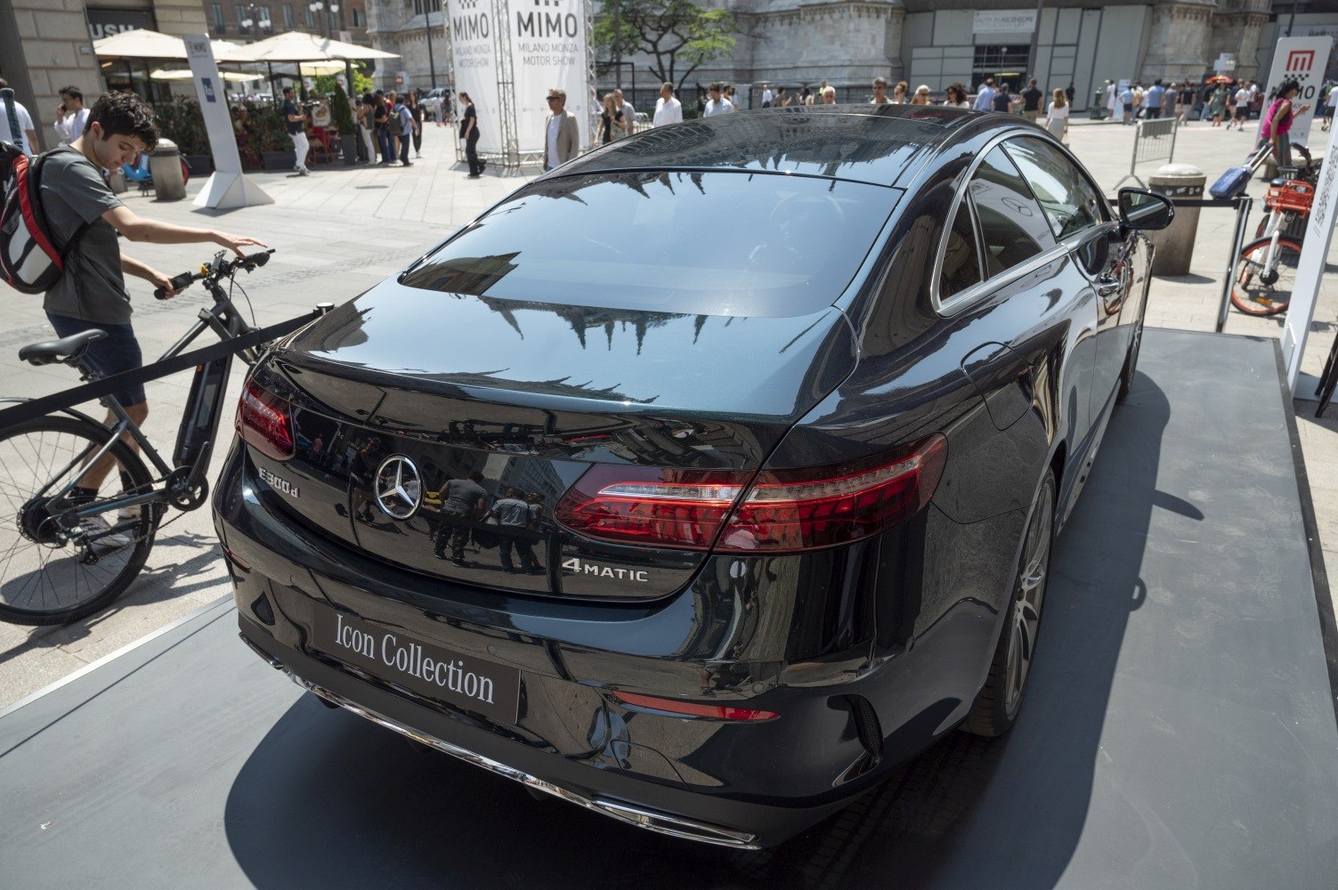 Rear view of a black luxury coupe with distinctive taillights and 4MATIC badge