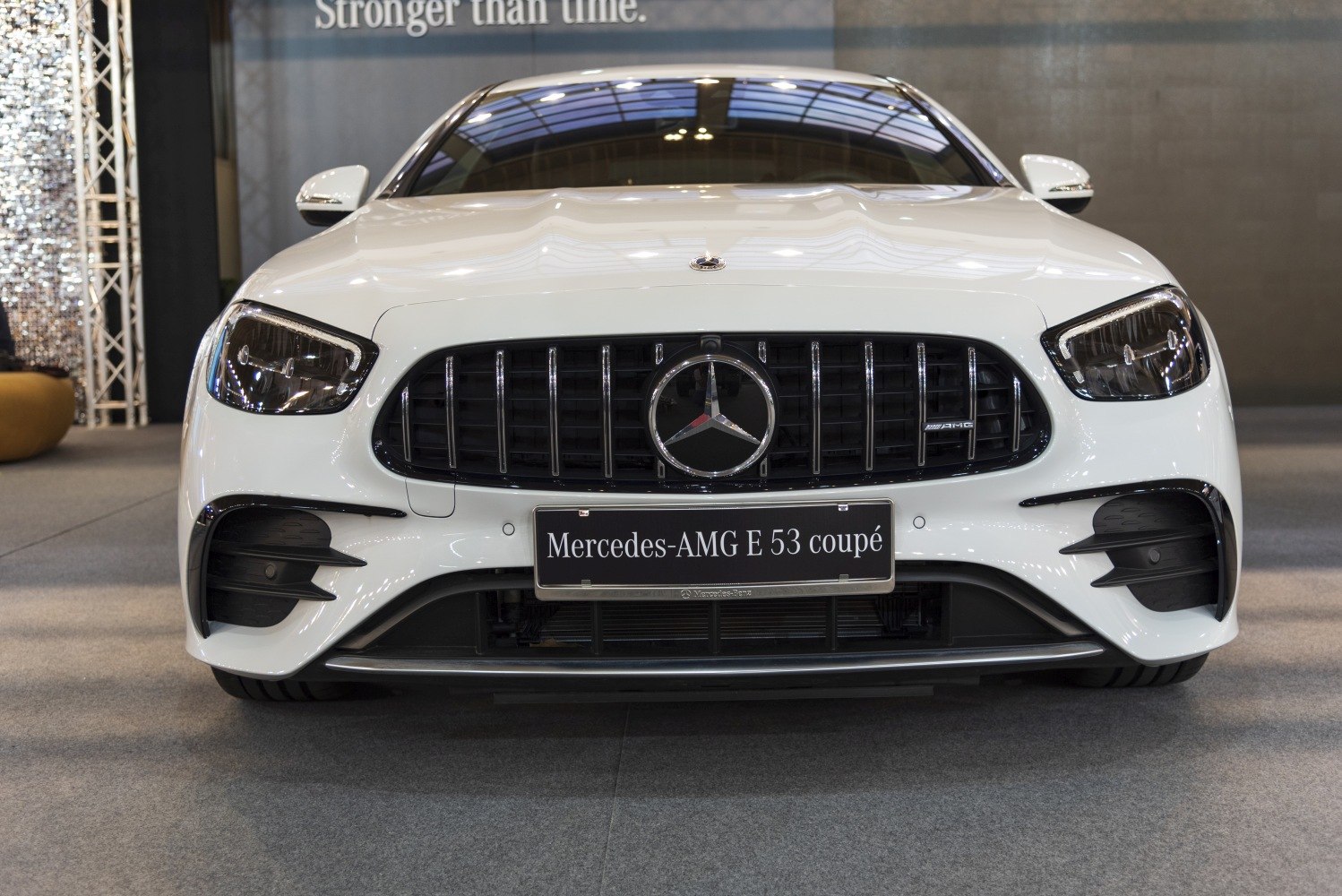 Front view featuring AMG grille and headlights of a luxury coupe