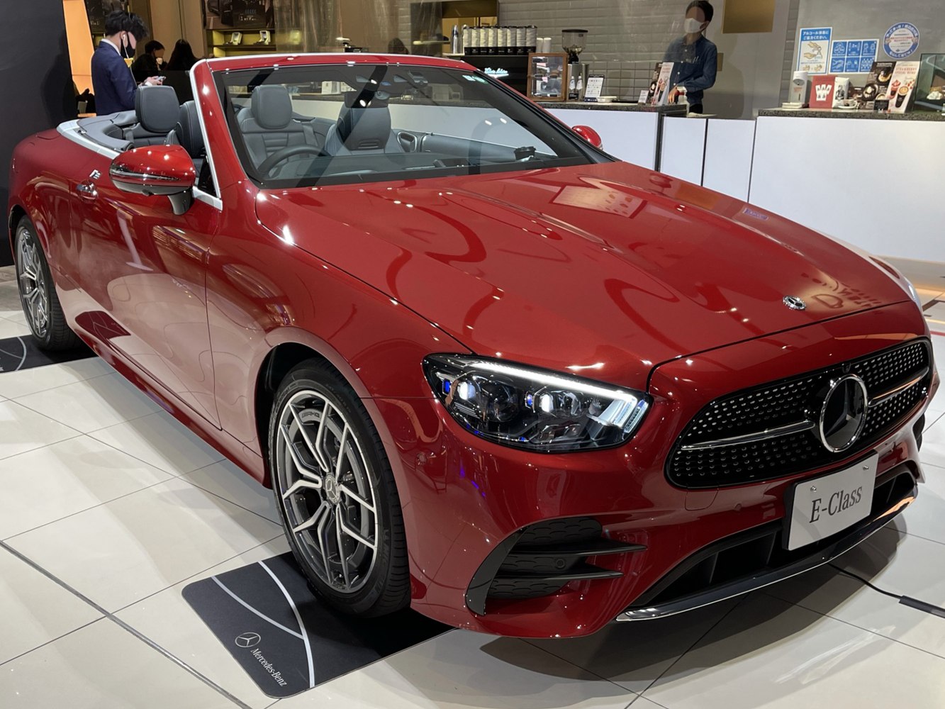 Red convertible with detailed front grille and LED headlights