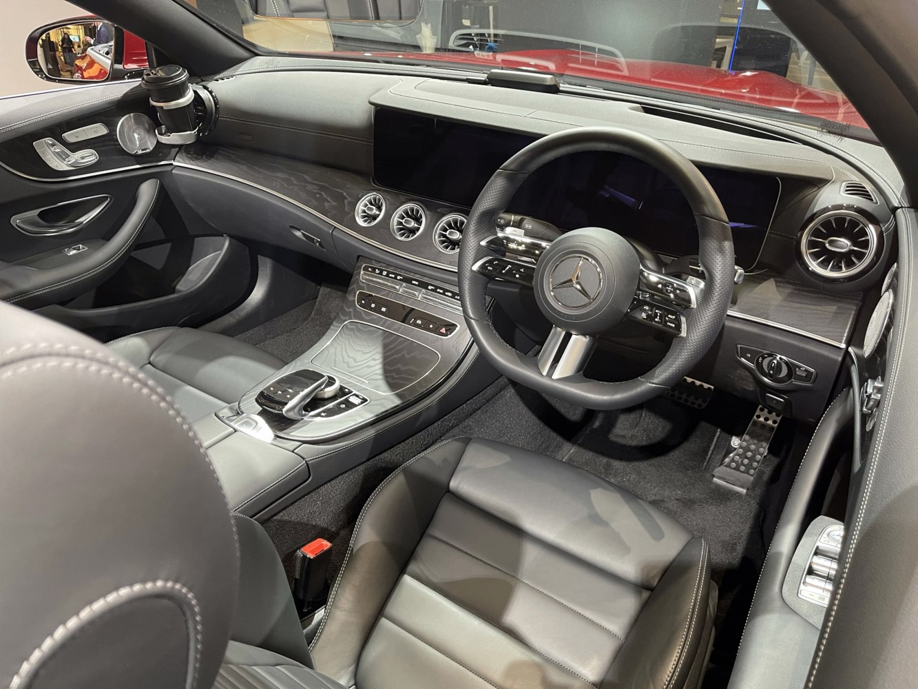 Modern luxury dashboard and steering wheel with advanced control panel