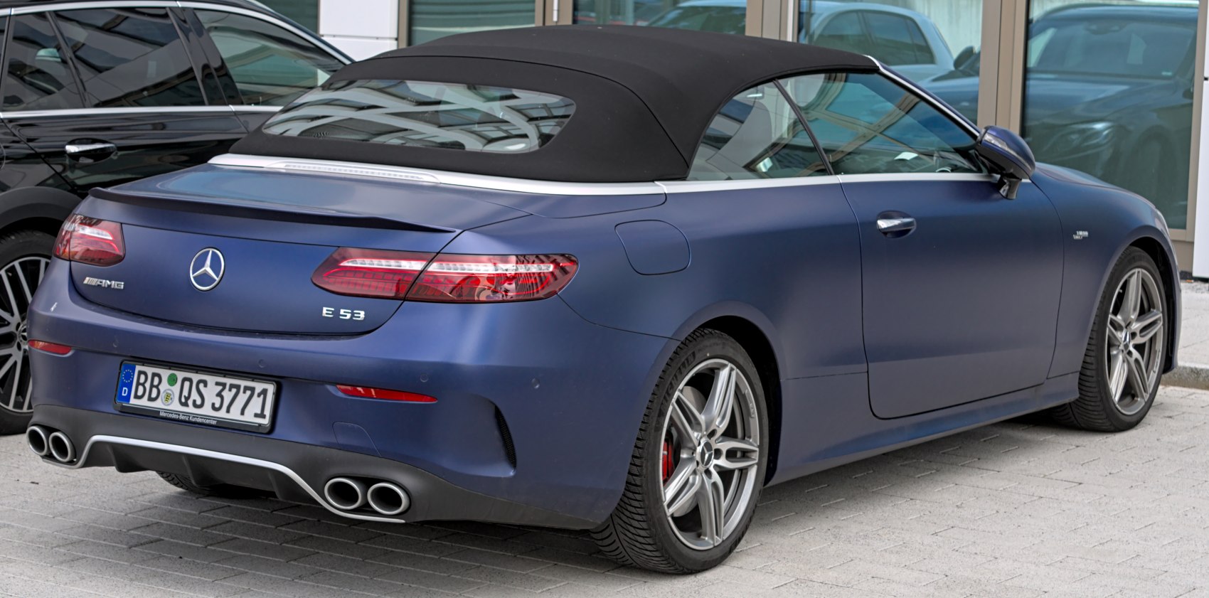 Rear view of E-class Cabriolet with quad exhausts and soft top