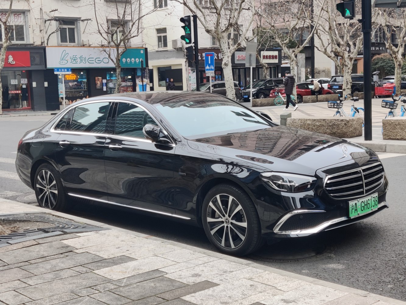 Black executive sedan with chrome grille and alloy wheels