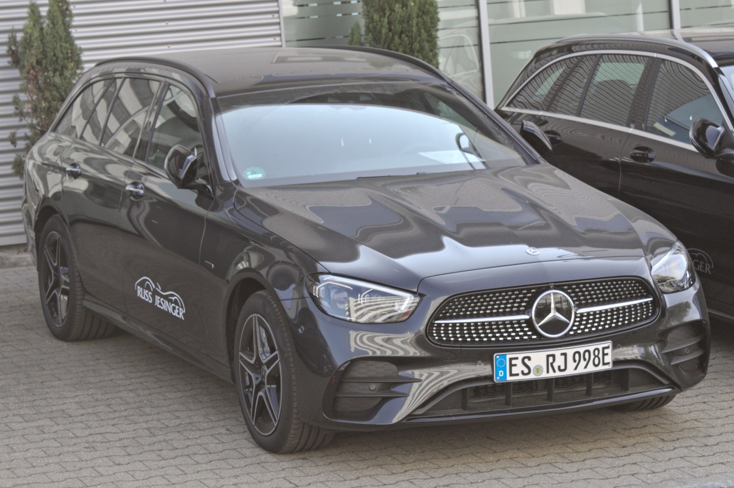 Front and side view of a modern station wagon with alloy wheels and signature grille