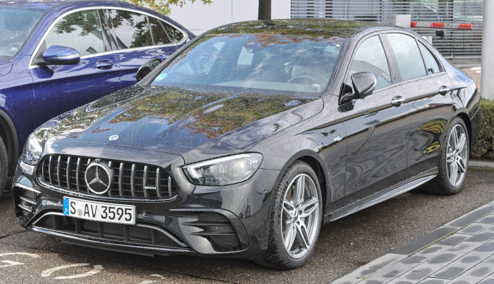 Front grille and LED headlights of a luxury sedan with turbo badge and alloy wheels