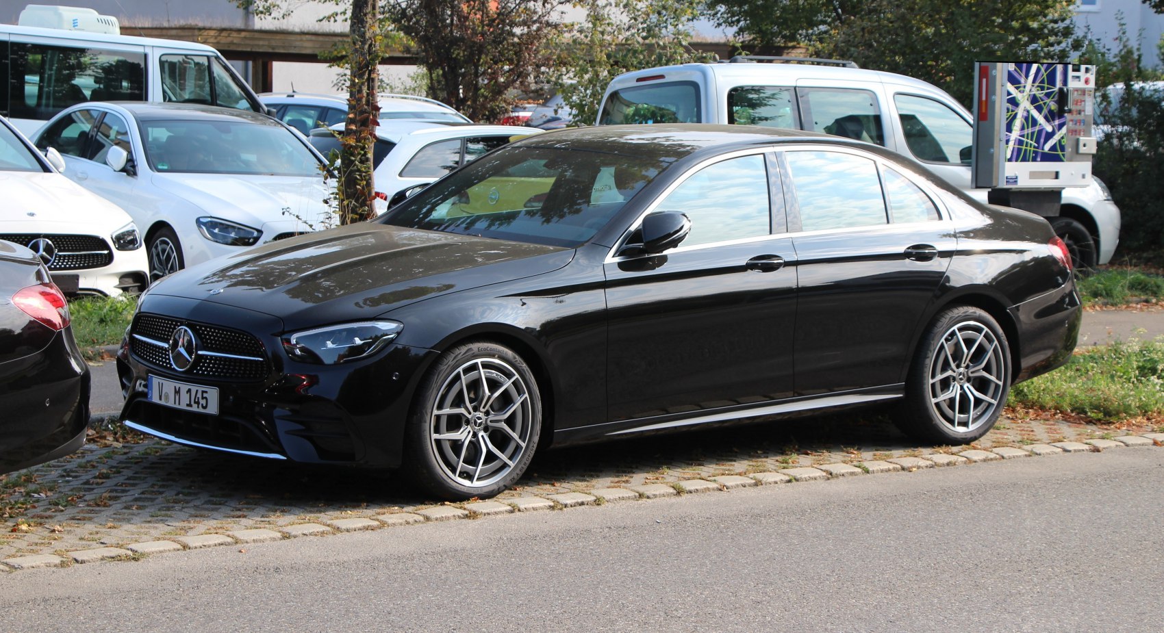 Luxury sedan exterior with signature grille and alloy wheels